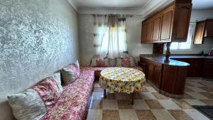 a living room with a couch and a table at Melilla Gate House in Nador