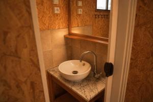 a bathroom with a sink and a mirror at Tiny House nearby Spa Francorchamps in Amblève