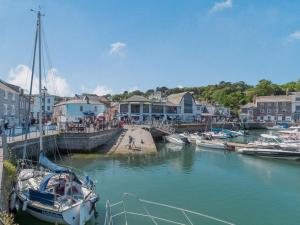 a group of boats docked in a harbor with buildings at 2 Bed in Padstow oc-p00876 in Padstow