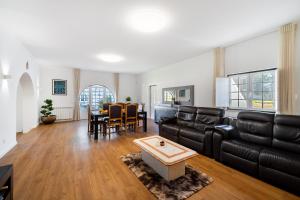 a living room with a couch and a table at Quinta do Outeiro by Soulplaces in Almargem