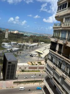 a view of a city with a building and a street at Montaza World inn in Alexandria