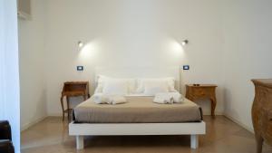 a bedroom with a bed with two towels on it at B&B Estea Tropea in Tropea +45 photos