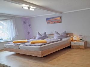 a bedroom with a large bed in a room at Ferienhaus Figelski in Sassnitz