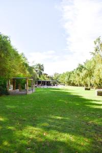 a park with a gazebo in the grass at Kwelanga River Lodge in Vioolsdrif