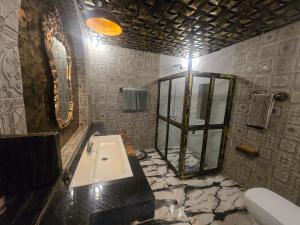 a bathroom with a sink and a mirror at Dar Al Masyaf in Sharan