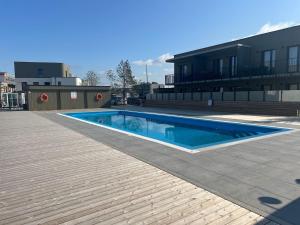a swimming pool in the middle of a building at Cozy Home Oasis in Palanga