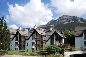 a hotel with a mountain in the background at Schweizerhof Drescher 612 in Lenzerheide