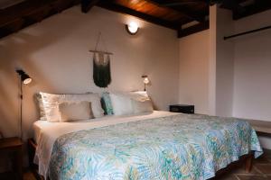 a bedroom with a large bed in a room at Posada Casa Play Los Roques in El Roque