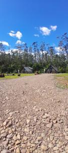 a large gravel road with houses in the background at Sombra do baú - Aurora in Timbe do Sul
