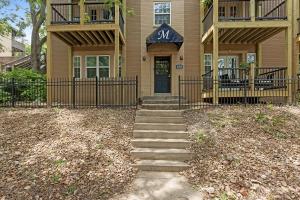 a house with stairs leading to the front door at Plaza Condo With Queen Bed 3 in Kansas City
