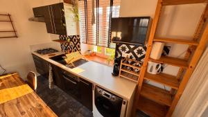 a small kitchen with a counter and a stove at Montoir-de-Bretagne in Montoir-de-Bretagne