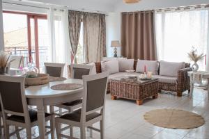 a living room with a couch and a table at Christina's Home in Skiathos