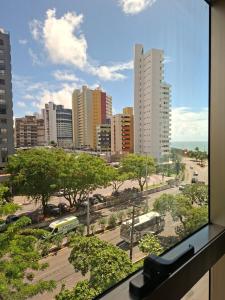 a view from a window of a city with buildings at Brisa Calma Premium Flat - PontaNegra in Natal