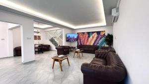 a living room with a couch and a table at Family Beach Villas in Salalah