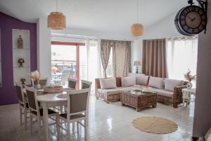 a living room with a couch and a table at Christina's Home in Skiathos