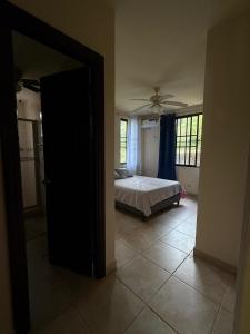 a bedroom with a bed and a ceiling fan at Casa Flussy in Sorá +2 photos