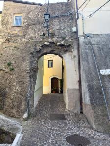 an alley in a stone building with an archway at Da Nonna Pasqualina in Ciorlano