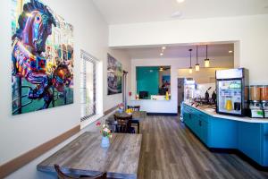 a kitchen with a counter and a dining room at Carousel Beach Inn in Santa Cruz