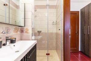 a bathroom with a glass shower and a sink at Olgi Milla Villa in Balatonalmádi +47 photos