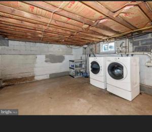 a laundry room with a washing machine in it at Need a room i got you in Frederick