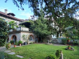 an old house with a yard with a tree at Dimora Da Castello Lago Maggiore in Gravellona Toce +30 photos