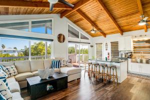 a living room with a couch and a table at BP05FLR Tradewinds Treat in Big Pine Key