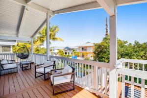 a porch with chairs and a view of the ocean at BP05FLR Tradewinds Treat in Big Pine Key