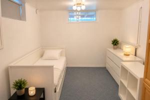 a small bedroom with a bed and a window at Boende i Vimmerby in Vimmerby +25 photos