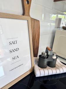 a picture of salt and sea in a frame on a table at The Hidden Gem in Mablethorpe