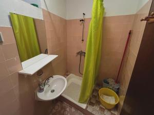 a small bathroom with a sink and a shower at APARTMAN RUŽICA in Cres