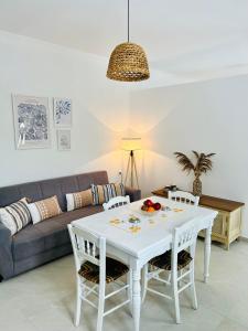a living room with a white table and a couch at Serenity in Petra
