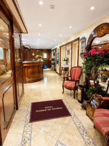 a salon with a sign that reads best church of wales at Hotel Ciudad de Vitoria in Santiago