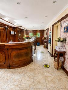 a large room with a bar in the middle at Hotel Ciudad de Vitoria in Santiago
