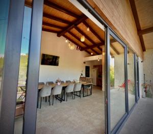 a dining room with a table and chairs at Salt Cabins in Ocniţa