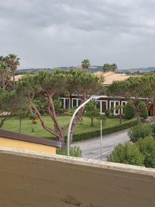 a view of a street with a fountain in a park at Blu 31 Marcelli in Marcelli