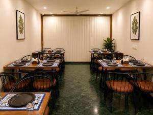 a row of tables and chairs in a restaurant at The Grand Uddhav - a botique hotel in Udaipur