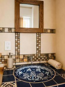 a bathroom with a sink and a mirror at Beachfront - Private Floor, 4 Rooms - Casa 3 Lunas in Playa Agua Blanca