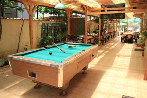 a pool table in a building with a pool table at Хостел Бреза in Sunny Beach
