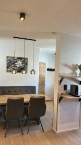 a dining room with a table and chairs at ONO Apartments in Längenfeld