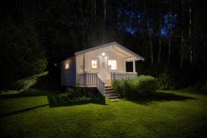 a small house in a yard at night at Cosy house in Ringebu kommune in Ringebu