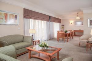a living room with a couch and a table at Holiday Inn Citystars by IHG in Cairo