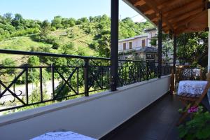 a balcony with a view of a hill at Old Bridge Guest House in Gjirokastër