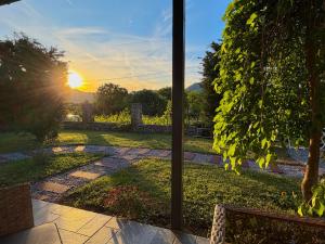 a view of the sunset from the patio of a house at Sunlight Cottage Maya in Virpazar