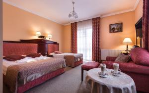 Posteľ alebo postele v izbe v ubytovaní Hotel Adam & Spa + 37 fotografií