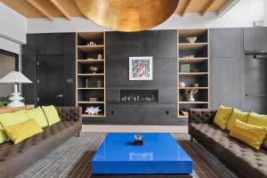 a living room with a couch and a table at Sentral West Midtown at Star Metals in Atlanta +40 photos