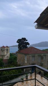 a view of a house from a balcony at Geamare Studios in Kálamos