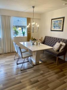 a living room with a table and a couch at Apartment Mandal in Mandal +16 photos