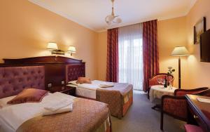 Posteľ alebo postele v izbe v ubytovaní Hotel Adam & Spa