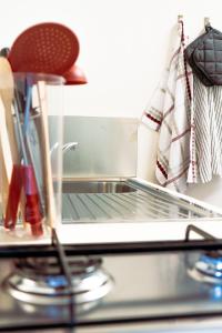 a laptop computer sitting on top of a counter at Dimora al Glicine in Sernaglia della Battaglia +19 photos