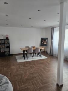 a dining room with a table and chairs at Post 25 in Slezská Ostrava +12 photos